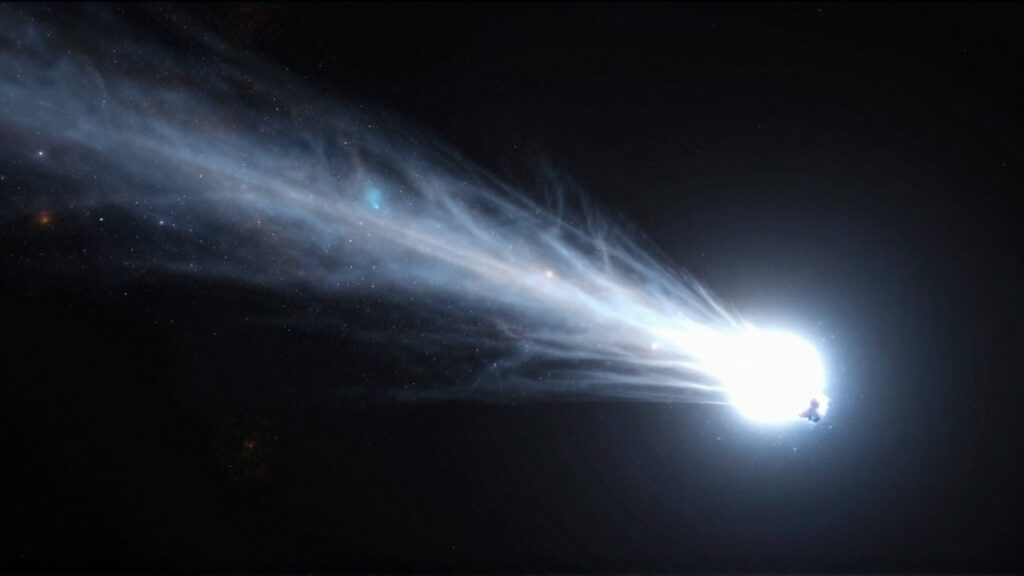 Cometa de gran tamaño con una brillante cola de gas y polvo atravesando el espacio profundo.